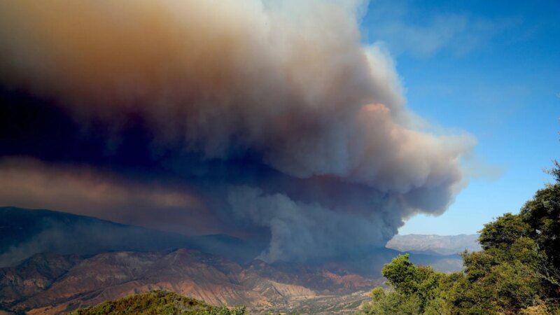 California wildfire smoke rising over hills