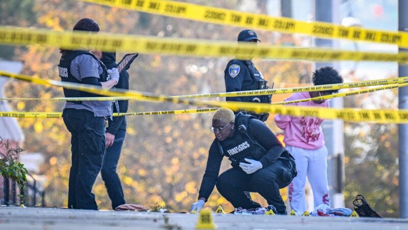 Forensics officers work behind police tape at a Baltimore shooting scene (Photo: breakingnewstoday.eu)