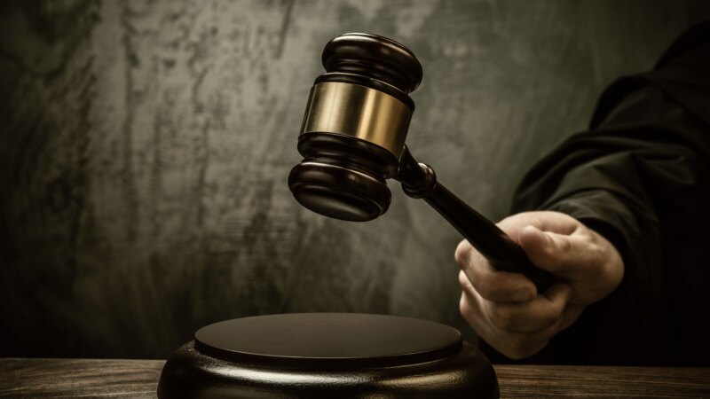 Judge's gavel on a courtroom table (photo via simslawoffice.com)