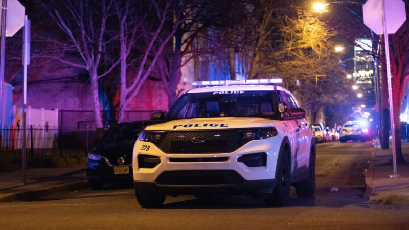 Philadelphia police SUV at a night crime scene in West Philadelphia