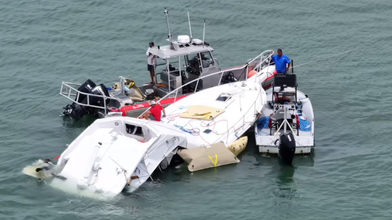Aerial view of the capsized sailboat and rescue boats in Biscayne Bay after the fatal 2025 crash
